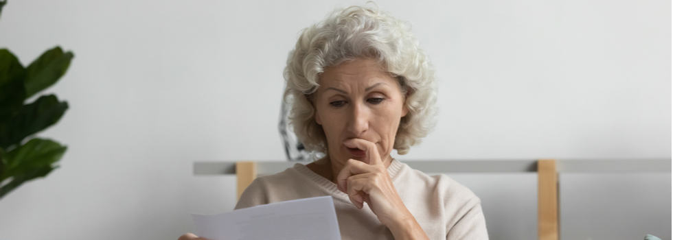 A woman looking at some paperwork.