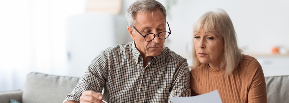 A couple reviewing paperwork together.