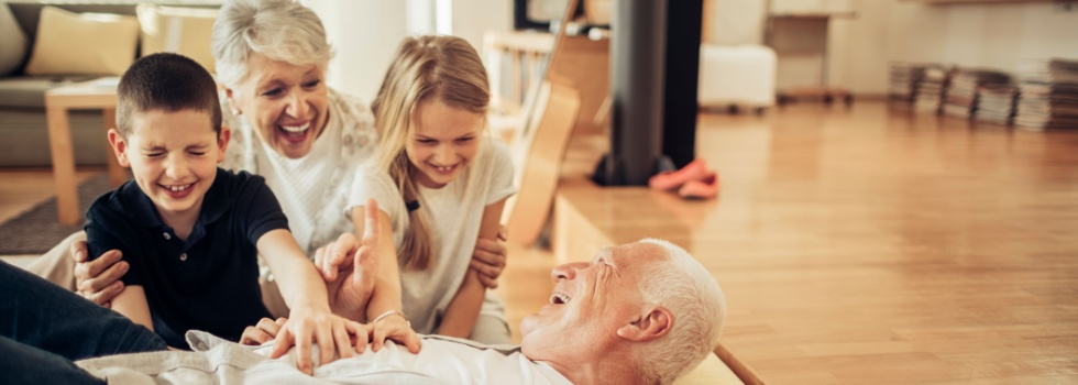 Grandparents playing with their grandchildren.