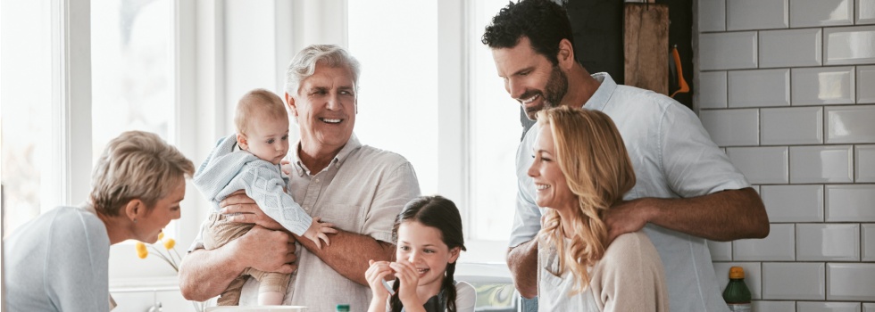 Three generations of family cooking in the kitchen