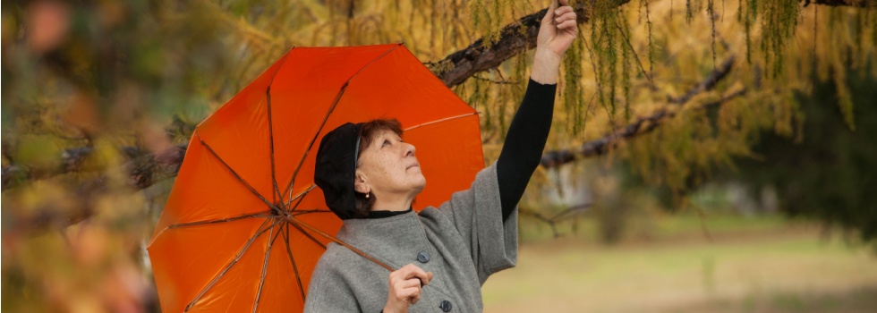 A woman under an umbrella.