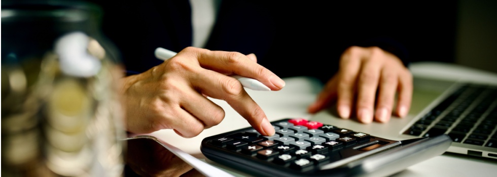 A person using a calculator.