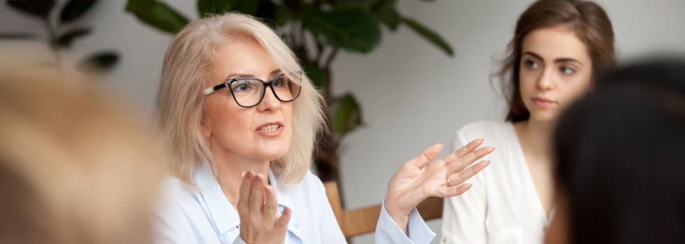 A woman talking during a work meeting.