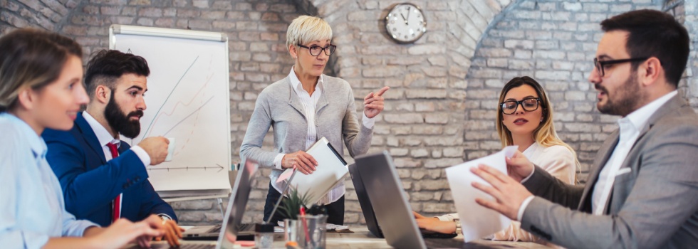 A group of colleagues sitting around a conference table.