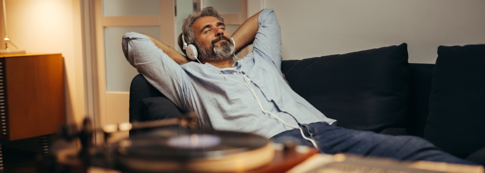 A man relaxing while listening to music.