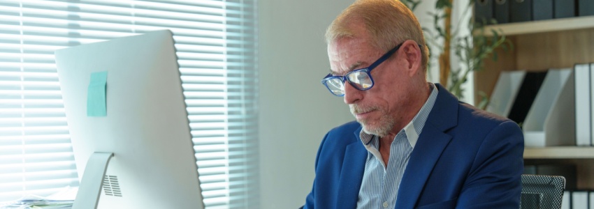 A man working at an office desk.