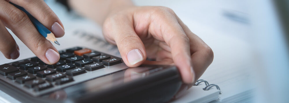 A person using a calculator.