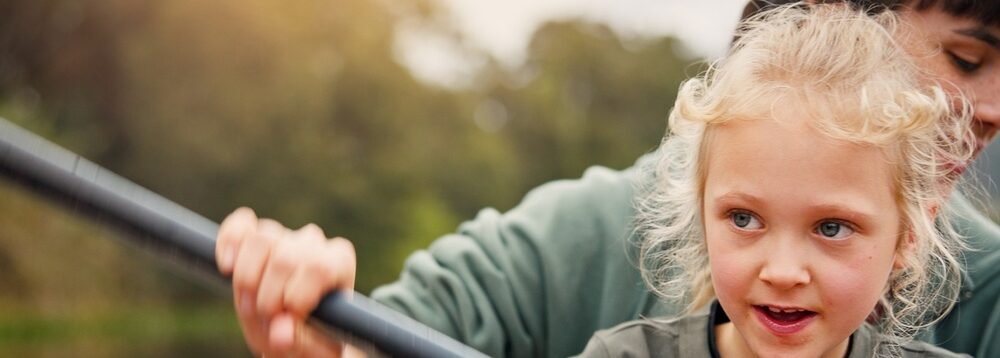 A mum and child kayaking.