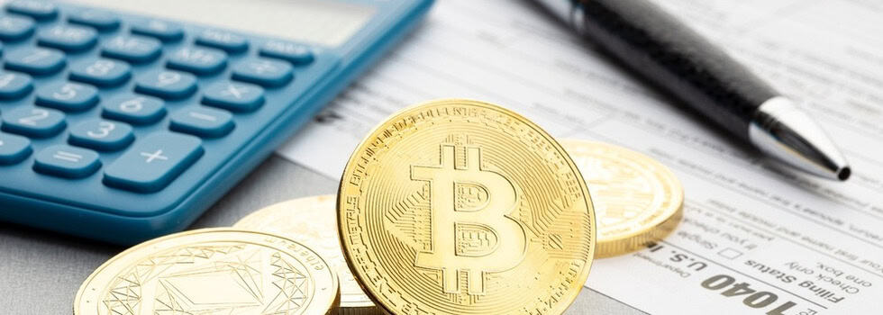 A representation of cryptocurrency next to a calculator.
