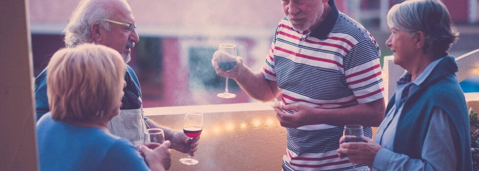 A group of people taking and drinking wine.